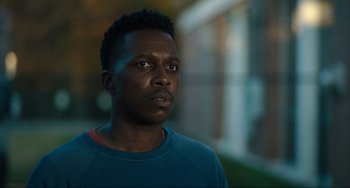 Movie still from “The Exorcist: Believer” (2023), directed by David Gordon Green – A person looking at the camera; Close Up shot, Low angle