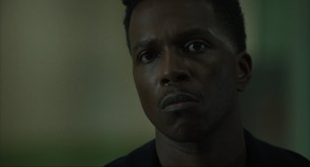 Movie still from “The Exorcist: Believer” (2023), directed by David Gordon Green – A person looking at the camera; Close Up shot, Low angle