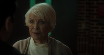 Movie still from “The Exorcist: Believer” (2023), directed by David Gordon Green – An older woman with white hair looking at the camera; Close Up shot, Over the shoulder angle