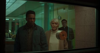 Movie still from “The Exorcist: Believer” (2023), directed by David Gordon Green – A group of people standing in front of a mirror; Medium shot, Low angle