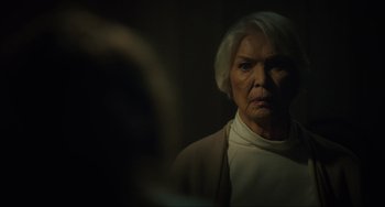 Movie still from “The Exorcist: Believer” (2023), directed by David Gordon Green – An older woman is looking into a mirror; Close Up shot, Over the shoulder angle