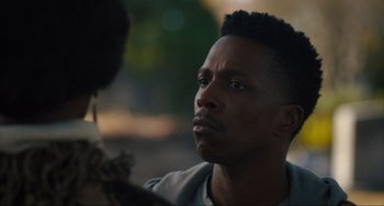 Movie still from “The Exorcist: Believer” (2023), directed by David Gordon Green – A person looking at a camera; Close Up shot, Over the shoulder angle