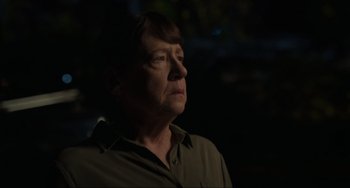 Movie still from “The Exorcist: Believer” (2023), directed by David Gordon Green – An older woman is looking up at the sky at night; Close Up shot, Over the shoulder angle