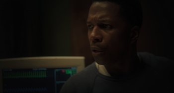 Movie still from “The Exorcist: Believer” (2023), directed by David Gordon Green – A person in a room with a computer; Close Up shot, Low angle