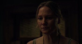 Movie still from “The Exorcist: Believer” (2023), directed by David Gordon Green – A person wearing a necklace; Close Up shot, Over the shoulder angle