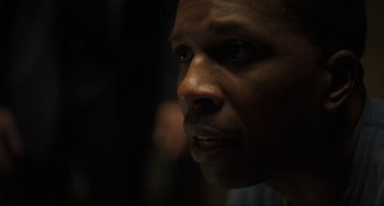 Movie still from “The Exorcist: Believer” (2023), directed by David Gordon Green – A man's face in the dark; Close Up shot, Over the shoulder angle