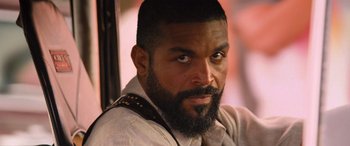 Movie still from “The Fate of the Furious” (2017), directed by F. Gary Gray – A person with a beard; Close Up shot, Over the shoulder angle