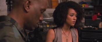 Movie still from “The Fate of the Furious” (2017), directed by F. Gary Gray – A woman and a man are looking at one another; Close Up shot, Over the shoulder angle