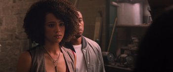 Movie still from “The Fate of the Furious” (2017), directed by F. Gary Gray – A man and a woman standing next to each other; Close Up shot, Over the shoulder angle