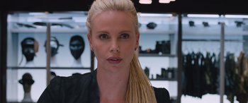 Movie still from “The Fate of the Furious” (2017), directed by F. Gary Gray – A person with blonde hair; Close Up shot, Over the shoulder angle