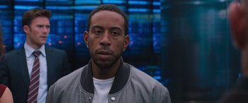 Movie still from “The Fate of the Furious” (2017), directed by F. Gary Gray – A person wearing a jacket; Close Up shot, Low angle