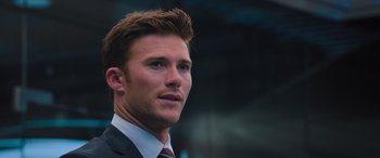 Movie still from “The Fate of the Furious” (2017), directed by F. Gary Gray – A person wearing a suit and tie; Close Up shot, Low angle