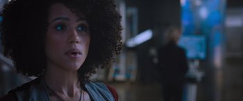Movie still from “The Fate of the Furious” (2017), directed by F. Gary Gray – A person with curly hair; Close Up shot, Over the shoulder angle