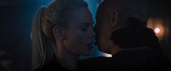 Movie still from “The Fate of the Furious” (2017), directed by F. Gary Gray – A man and a woman are kissing in a dark room; Close Up shot, Over the shoulder angle
