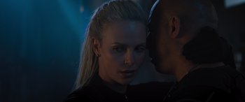 Movie still from “The Fate of the Furious” (2017), directed by F. Gary Gray – A person wearing a black shirt; Close Up shot, Over the shoulder angle