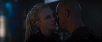 Movie still from “The Fate of the Furious” (2017), directed by F. Gary Gray – A man and a woman face to face in a dark room; Close Up shot, Over the shoulder angle