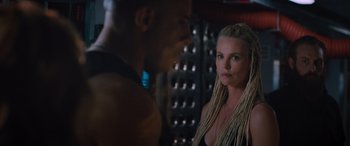 Movie still from “The Fate of the Furious” (2017), directed by F. Gary Gray – A man and a woman are looking at one another; Close Up shot, Over the shoulder angle