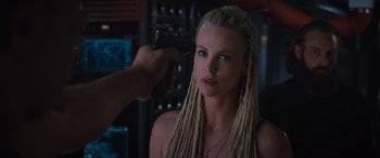 Movie still from “The Fate of the Furious” (2017), directed by F. Gary Gray – A woman with blonde hair is being filmed by a man; Close Up shot, Over the shoulder angle