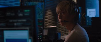 Movie still from “The Fate of the Furious” (2017), directed by F. Gary Gray – A man with a headset looking at a computer screen; Close Up shot, Over the shoulder angle
