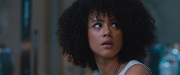 Movie still from “The Fate of the Furious” (2017), directed by F. Gary Gray – A person with a curly hair; Close Up shot, Over the shoulder angle