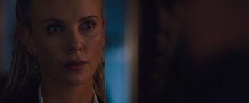 Movie still from “The Fate of the Furious” (2017), directed by F. Gary Gray – A woman's face in front of a mirror; Close Up shot, Over the shoulder angle