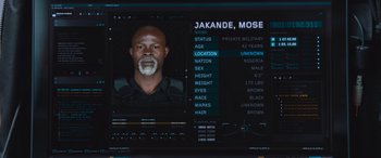 Movie still from “The Fate of the Furious” (2017), directed by F. Gary Gray – An image of an african american man in a uniform; Close Up shot, Overhead angle