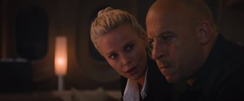 Movie still from “The Fate of the Furious” (2017), directed by F. Gary Gray – A man and a woman looking at the camera; Close Up shot, Over the shoulder angle
