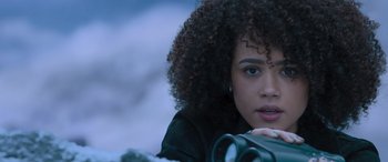 Movie still from “The Fate of the Furious” (2017), directed by F. Gary Gray – A beautiful young woman holding onto a camera; Close Up shot, Over the shoulder angle