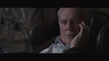 Movie still from “The Father” (2020), directed by Florian Zeller – An older man sitting in a chair with his head resting on his hand; Close Up shot, Over the shoulder angle