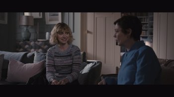 Movie still from “The Father” (2020), directed by Florian Zeller – Two people are sitting in a living room talking to each other; Medium shot, Over the shoulder angle