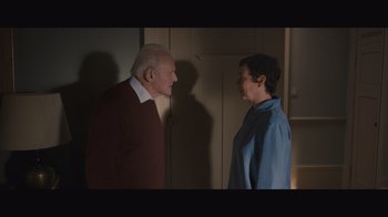 Movie still from “The Father” (2020), directed by Florian Zeller – A man and a woman standing next to each other in a room; Medium shot, Over the shoulder angle