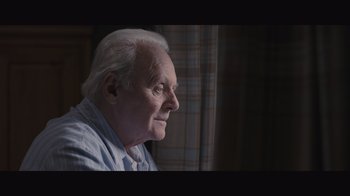 Movie still from “The Father” (2020), directed by Florian Zeller – An older man sitting in front of a window; Close Up shot, Over the shoulder angle