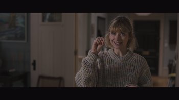 Movie still from “The Father” (2020), directed by Florian Zeller – A woman is smiling while holding a tooth brush; Close Up shot, Over the shoulder angle