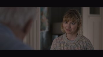 Movie still from “The Father” (2020), directed by Florian Zeller – A woman in a sweater looking at the camera; Close Up shot, Over the shoulder angle