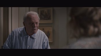 Movie still from “The Father” (2020), directed by Florian Zeller – An older man in a striped shirt is looking at the camera; Close Up shot, Over the shoulder angle