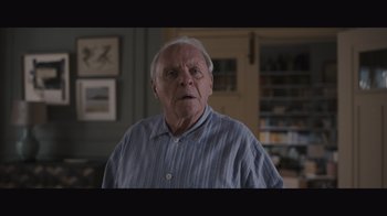 Movie still from “The Father” (2020), directed by Florian Zeller – An older man in a blue striped shirt is looking at the camera; Close Up shot, Low angle
