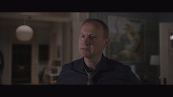 Movie still from “The Father” (2020), directed by Florian Zeller – A person wearing a shirt and a tie; Close Up shot, Over the shoulder angle