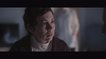 Movie still from “The Father” (2020), directed by Florian Zeller – A woman with short brown hair wearing a white sweater; Close Up shot, Over the shoulder angle