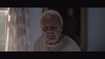 Movie still from “The Father” (2020), directed by Florian Zeller – An old man with a white beard is looking at the camera; Close Up shot, Over the shoulder angle