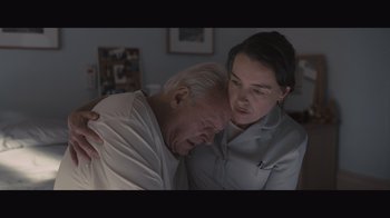 Movie still from “The Father” (2020), directed by Florian Zeller – An older man and a younger woman looking at each other; Close Up shot, Low angle