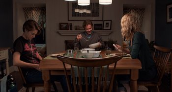 Movie still from “The Fault in Our Stars” (2014), directed by Josh Boone – A group of people sitting around a table eating food; Wide shot, High angle