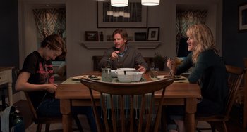 Movie still from “The Fault in Our Stars” (2014), directed by Josh Boone – Three people sitting at a dinner table eating; Wide shot, High angle