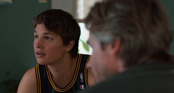 Movie still from “The Fault in Our Stars” (2014), directed by Josh Boone – A man sitting next to another man in front of a window; Close Up shot, Over the shoulder angle