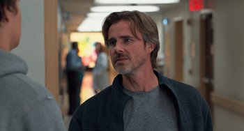 Movie still from “The Fault in Our Stars” (2014), directed by Josh Boone – A person wearing a jacket in a room; Close Up shot, Over the shoulder angle