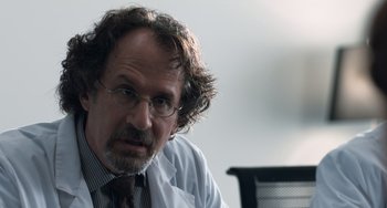 Movie still from “The Fault in Our Stars” (2014), directed by Josh Boone – An older man with glasses and a beard; Close Up shot, Over the shoulder angle