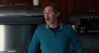 Movie still from “The Fault in Our Stars” (2014), directed by Josh Boone – A man standing in front of an oven with his mouth open; Close Up shot, Over the shoulder angle