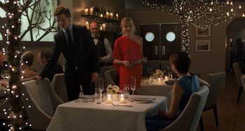 Movie still from “The Fault in Our Stars” (2014), directed by Josh Boone – A group of people standing around a dinner table; Wide shot, Over the shoulder angle