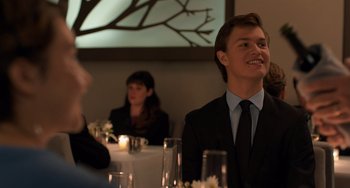 Movie still from “The Fault in Our Stars” (2014), directed by Josh Boone – A man sitting at a table in front of a woman; Medium shot, Over the shoulder angle