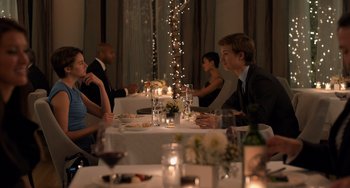 Movie still from “The Fault in Our Stars” (2014), directed by Josh Boone – A group of people sitting at a dinner table; Medium shot, Over the shoulder angle