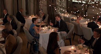 Movie still from “The Fault in Our Stars” (2014), directed by Josh Boone – A man and woman sitting at a dinner table; Wide shot, High angle